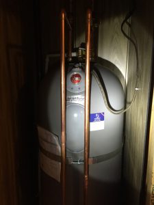 New 50 gal. Rheem hot water heater inside closet